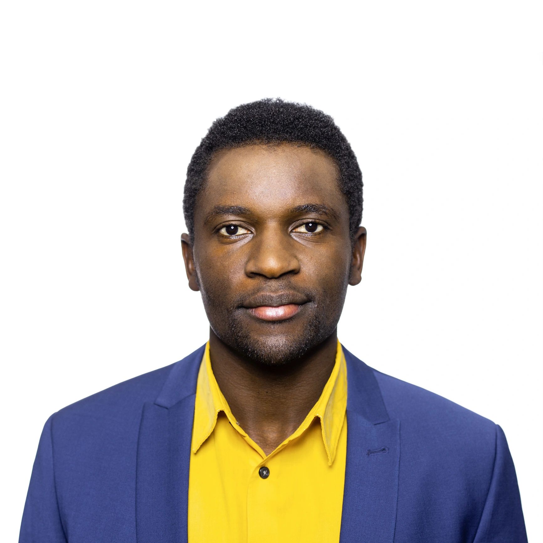 Professional headshot of a man on a white background