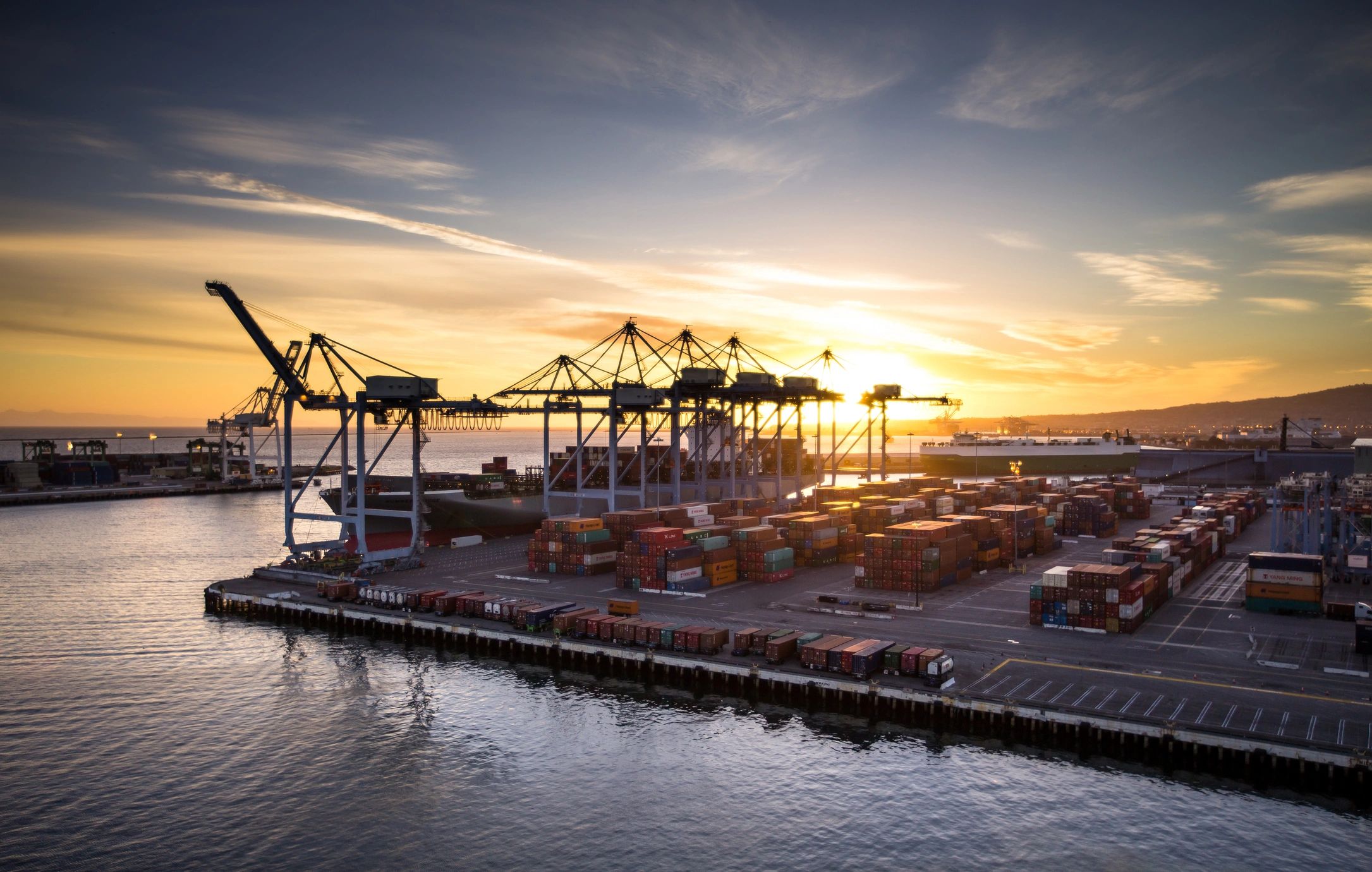 Container port at sunset representing global logistics